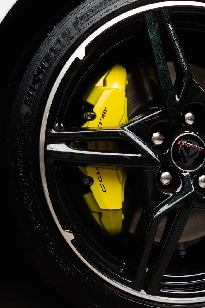 Detailed shot of a Chevrolet Corvette wheel rim with a bright yellow brake caliper.